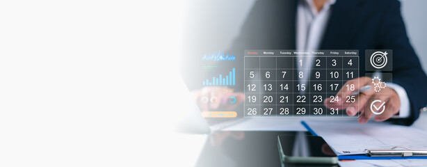 Person interacting with a digital calendar overlay, planning business tasks with icons for growth,...