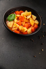 Stewed potatoes with carrots vegetarian side dish fresh delicious gourmet food background on the table rustic food top view copy space keto and paleo diet vegan food