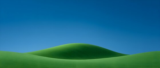 Obraz premium Serene green hills under a clear blue sky