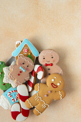 Gingerbread cookies with icing decoration. Christmas food. Gingerbread man baking. Treat top view table. Xmas sweet copy space background.