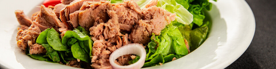 Tuna salad green leaf lettuce, canned tuna, tomato fresh delicious gourmet food background on the table rustic food top view copy space keto and paleo diet vegetarian food pescetarian diet