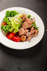 Tuna salad green leaf lettuce, canned tuna, tomato fresh delicious gourmet food background on the table rustic food top view copy space keto and paleo diet vegetarian food pescetarian diet