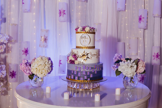 quinceanera cake on a table with decorations