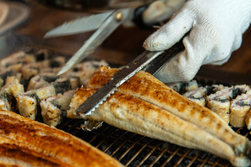roasting eels on the charcoal grill