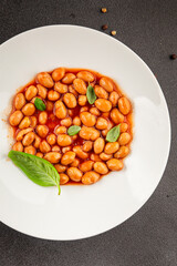 Bean stew tomato sauce cranberry beans vegetable dish beans borlotti fresh delicious gourmet food background on the table rustic food top view copy space keto and paleo diet vegan and vegan food