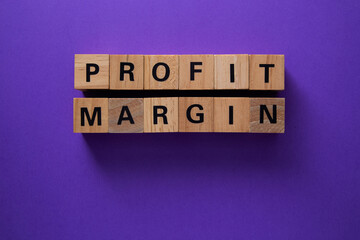 Wooden cubes showing profit margin on purple background