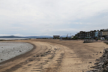 A view of Morecambe, Lancashire, England across a wide expanse of sand.