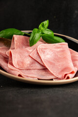 Ham slices meat spam pork fresh delicious gourmet food background on the table rustic food top view...