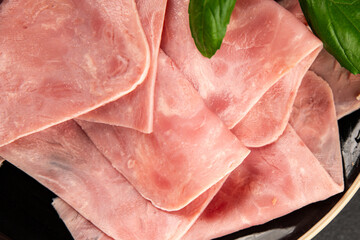 Ham slices meat spam pork fresh delicious gourmet food background on the table rustic food top view...