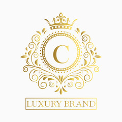 Luxurious and elegant logo design with a stylized letter C in gold featuring regal floral embellishments
