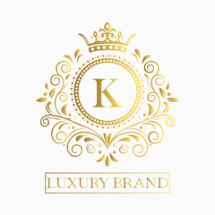 Luxurious and elegant logo design with a stylized letter K in gold featuring regal floral embellishments