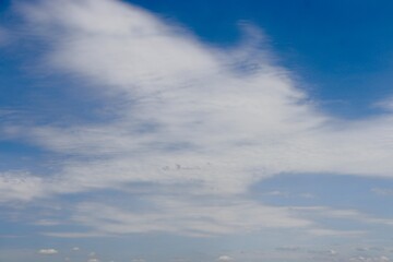The white cloud in the blue sky.
