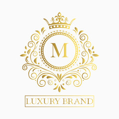 Luxurious and elegant logo design with a stylized letter M in gold featuring regal floral embellishments