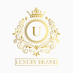 Luxurious and elegant logo design with a stylized letter U in gold featuring regal floral embellishments