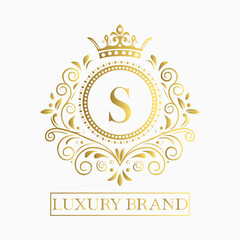Luxurious and elegant logo design with a stylized letter S in gold featuring regal floral embellishments