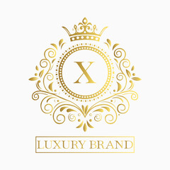 Luxurious and elegant logo design with a stylized letter X in gold featuring regal floral embellishments