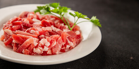 Bacon cubes smoked chopped meat small pieces fresh delicious gourmet food background on table rustic food top view copy space