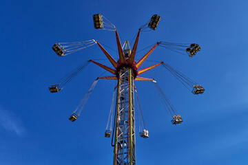 Flying swing ride in fast motion