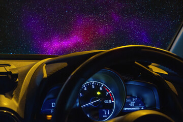 View of the universe with stars through the windshield of a moving car