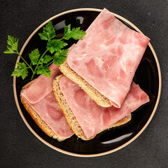 Sandwich ham slices meat spam pork fresh delicious gourmet food background on the table rustic food...