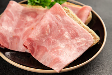 Sandwich ham slices meat spam pork fresh delicious gourmet food background on the table rustic food...