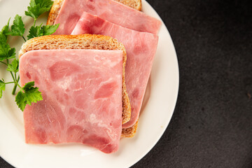 Sandwich ham slices meat spam pork fresh delicious gourmet food background on the table rustic food...