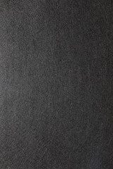 Dark textured surface showcases unique subtle patterns and depth for artistic exploration