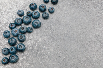 Blueberries on a silver surface make an appealing healthy snack display