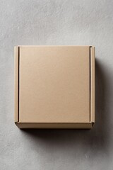 A simple, top-down shot of a closed cardboard box, ready for shipping or storage. The box sits against a neutral background.