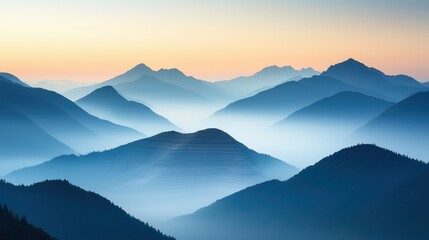 Obraz premium A serene sunrise casts soft light over layered mountain ranges, enveloped in mist and creating a tranquil, ethereal landscape.