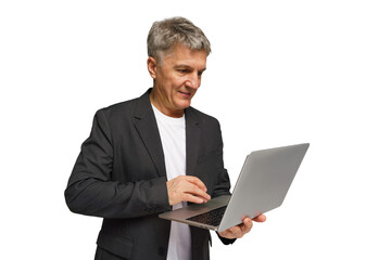 Businessman engaging with laptop and smiling in a modern workspace during a productive session...