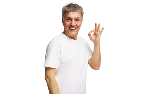 Joyful older man expressing happiness with an 'ok' gesture against a without a background - Powered by Adobe