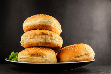 Bun burger puffy soft buns baking fresh delicious gourmet food background on the table rustic food...