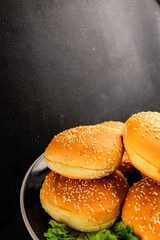 Bun burger puffy soft buns baking fresh delicious gourmet food background on the table rustic food...