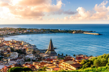 seascape panorama of mediterranean coast landscape with old italian town in golden sunset sun rays...