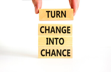 Turn change into chance symbol. Concept words phrase Turn change into chance on beautiful wooden...
