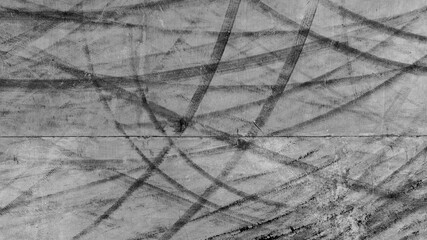 Aerial view car tire marks abstract street road background with black tire marks on race track, Texture and background car automobile and automotive skid tire marks.