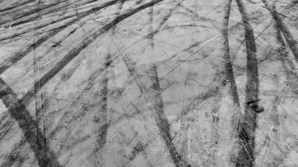 Aerial view car tire marks abstract street road background with black tire marks on race track,...
