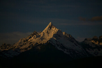 Majestic Meili Snow Mountain under moonlight at Night