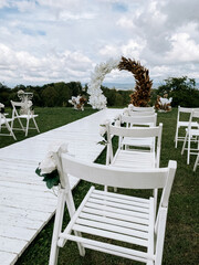 Beautiful outdoor wedding setup with elegant floral arrangements before the ceremony