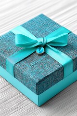 Teal gift box with turquoise ribbon