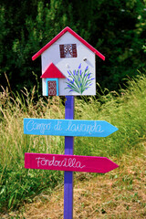 fraction of the municipality of Albera Ligure, in the province of Alessandria the town of scarecrows there are over 70 Vendersi Italy translation of signs: lavender field, villa bottom