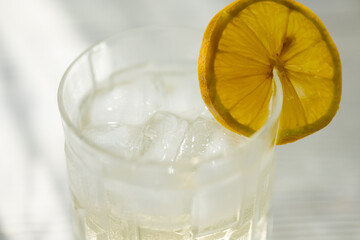 glass of cocktail with lemon close up