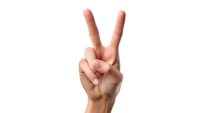 Victory Hand Gesture: A close-up of a hand displaying the victory sign, symbolizing success, peace, or simply a positive attitude.