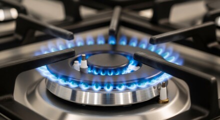 Blue flame of a gas burner on a modern kitchen stove. Natural gas combustion for home cooking and heating. Industrial energy consumption concept.