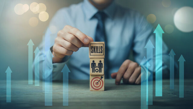 Man stacking wooden blocks with skills goal and people icons symbolizing career growth and development