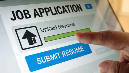 Close up of a person s finger interacting with a digital job application screen uploading a resume