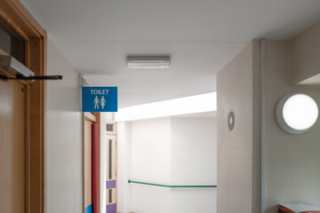 Male and Female toilet sign seen within the corridor of a typical NHS hospital in Britain. Various...