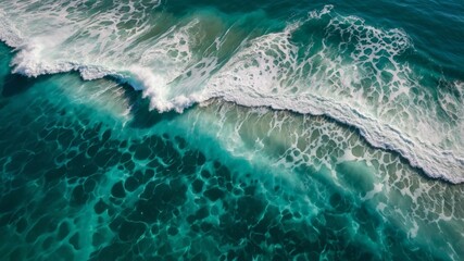 Waves Crashing on Turquoise Waters Create Mesmerizing Patterns Along the Shoreline at Midday Under a Clear Blue Sky