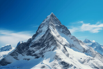 Snow-covered mountain peak under clear blue sky, cinematic 